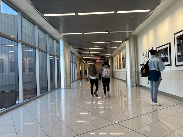 A walkway connects three new gates built off the end of Concourse E to the rest of the concourse inside Hartsfield-Jackson Atlanta International Airport. (Kelly Yamanouchi/AJC)