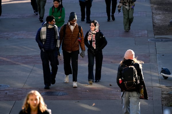 Georgia Tech students walk across campus amid freezing temperatures on Tuesday, Jan. 7, 2025 (Ben Hendren for the Atlanta Journal-Constitution)