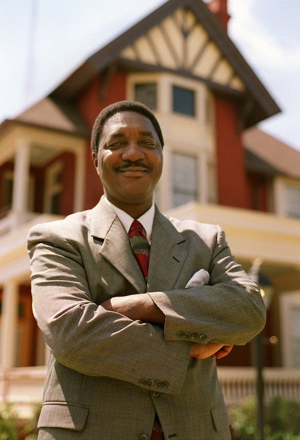 Ira Joe Johnson in 2012. Johnson is posing in front of the Margaret Mitchell House on Peachtree Street. He wrote a book about how Margaret Mitchell and Benjamin Mays worked together to help race relations. (Frank Niemeir/AJC file)