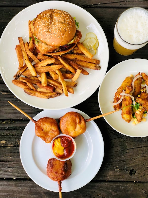 Takeout from Wrecking Bar: crispy cod sandwich with fries, corn pups, fried okra and the Juice Willis: What’s Just Hoppened IPA. 
CONTRIBUTED BY WENDELL BROCK