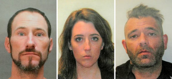 FILE - This November 2018 file combination of photos provided by the Burlington County Prosecutors office shows Johnny Bobbitt, left, Katelyn McClure and Mark D'Amico. On Tuesday, Dec. 25, 2018, GoFundMe says it has made refunds to everyone who contributed to a campaign involving homeless veteran Bobbitt who prosecutors allege schemed with a New Jersey couple, McClure and D'Amico, to scam donors out of $400,000.