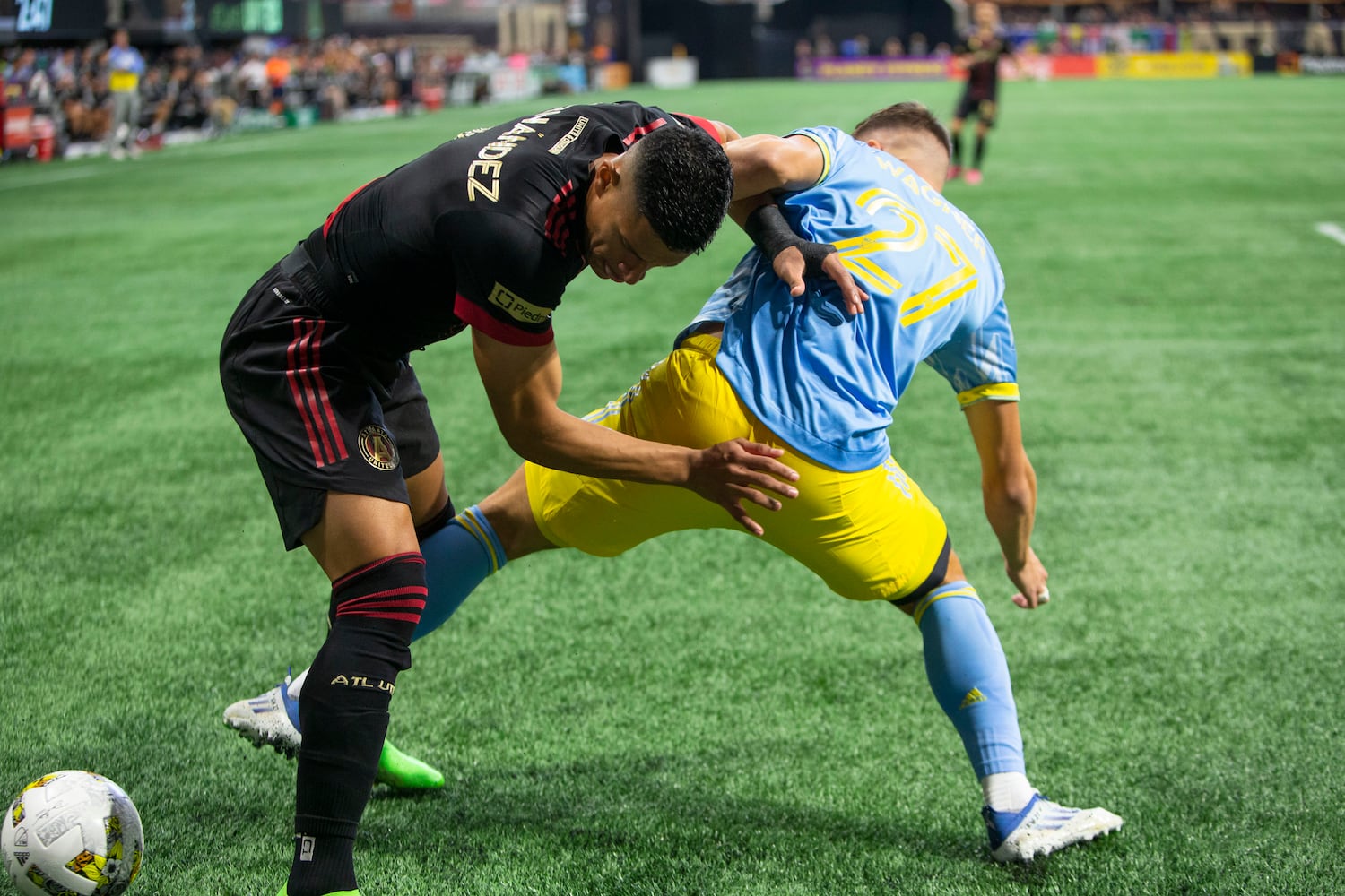 Ronald Hernández (left) of Atlanta United and Kai Wagner (right) of the Philadelphia Union fight for the ball. CHRISTINA MATACOTTA FOR THE ATLANTA JOURNAL-CONSTITUTION.