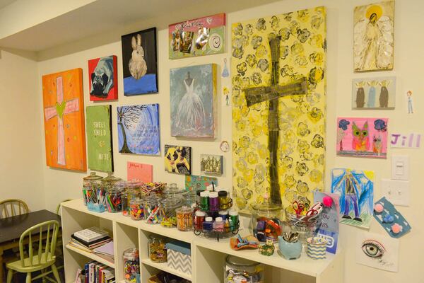 In the basement art studio, Edee has covered the walls in inspirational pieces, and art created by her family and their friends. She used containers from Wal-mart to organize supplies.