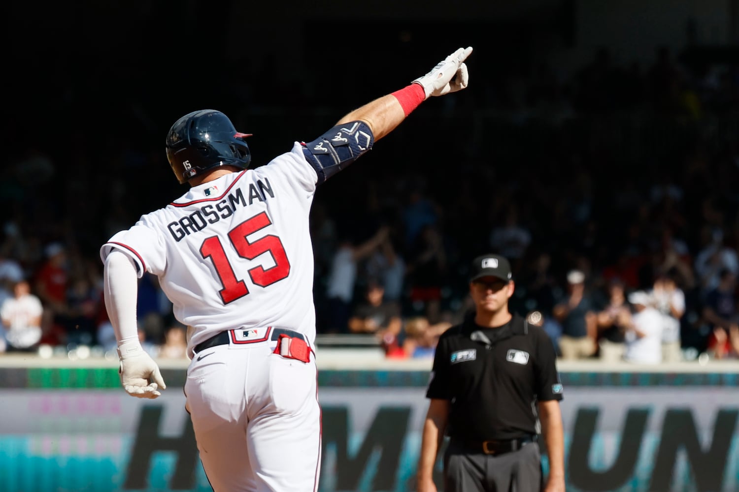 Braves outfielder Robbie Grossman reacts after hitting a home run during the seventh inning against the Phillies Sunday at Truist Park. (Miguel Martinez / miguel.martinezjimenez@ajc.com)