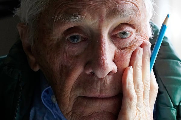 FILE - Artist Robert Seaman poses in his room at an assisted living facility Monday, May 10, 2021, in Westmoreland, N.H. . (AP Photo/Charles Krupa, File)