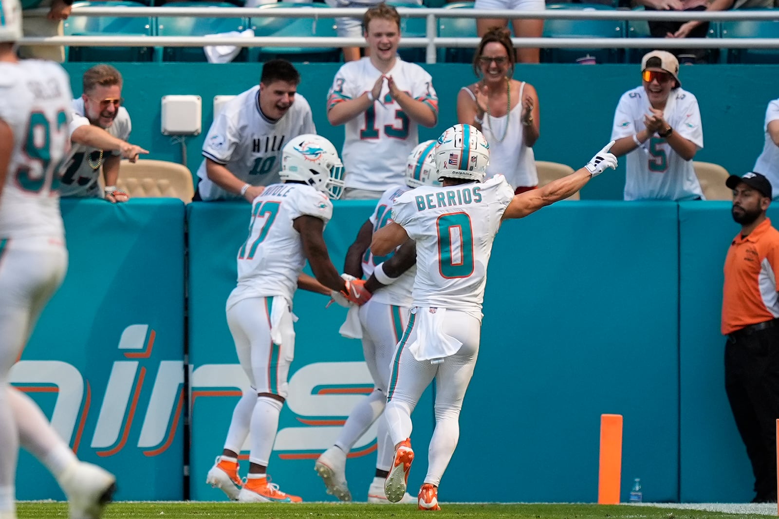 Miami Dolphins wide receiver Jaylen Waddle (17), Miami Dolphins wide receiver Braxton Berrios (0) celebrate a touchdown by Miami Dolphins wide receiver Tyreek Hill (10) during the second half of an NFL football game, Sunday, Sept. 8, 2024, in Miami Gardens, Fla. (AP Photo/Rebecca Blackwell)