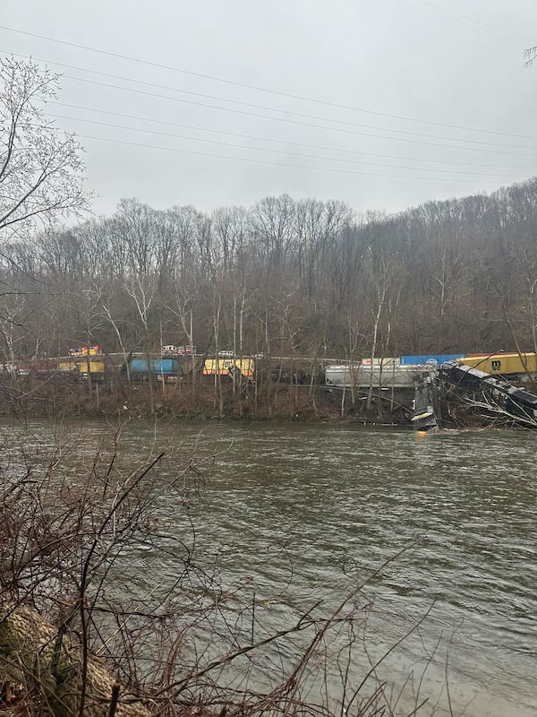 This photo provided by Nancy Run Fire Company shows a train derailment along a riverbank in Saucon Township, Pa., on Saturday, March 2, 2024.   Authorities said it was unclear how many cars were involved but no injuries or hazardous materials were reported.   (Nancy Run Fire Company via AP)