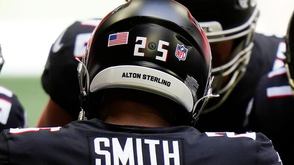 Atlanta Falcons running back Ito Smith wears a sticker on his helmet in remembrance of Alton Sterling during the game against the Seattle Seahawks on Sept. 13, 2020, in Atlanta. Sterling, a 37-year-old Black man, was shot dead by two Baton Rouge police officers in 2016. 