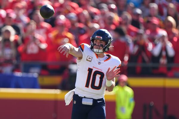 Denver Broncos quarterback Bo Nix throws during the first half of an NFL football game against the Kansas City Chiefs Sunday, Nov. 10, 2024, in Kansas City, Mo. (AP Photo/Charlie Riedel)