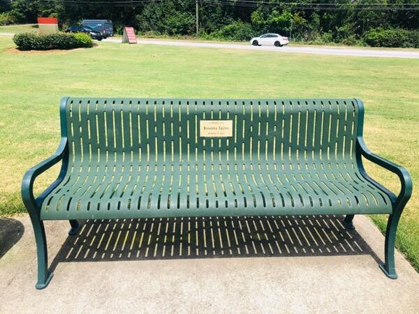 A Smyrna couple has dedicated three benches with plaques honor Ahmaud Arbery, Breonna Taylor and George Floyd. Credit: Damon Willis