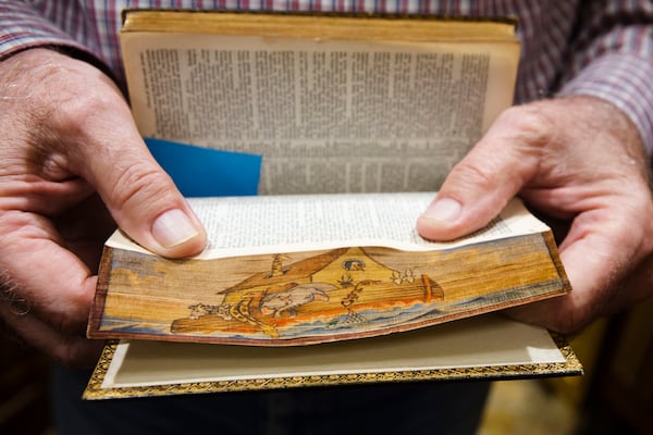 Fore-edge detailing is when publishes printed a scene on the edge of the pages. CHRISTINA MATACOTTA FOR THE ATLANTA JOURNAL-CONSTITUTION