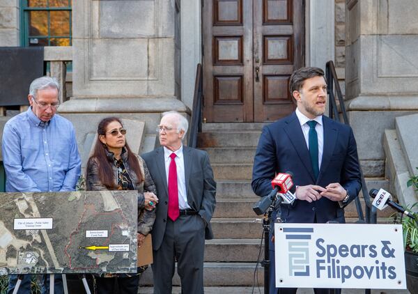 The family of Manuel Paez-Terán, known as Tortuguita, who was shot to death by Georgia State Patrol SWAT team members in 2023, gather outside the Decatur Courthouse to announce the filing of a lawsuit on Tuesday, Dec 17, 2024. Attorney Jeff Filipovits (right), who is representing the family in the lawsuit, takes questions during the news conference. (Jenni Girtman for the AJC)