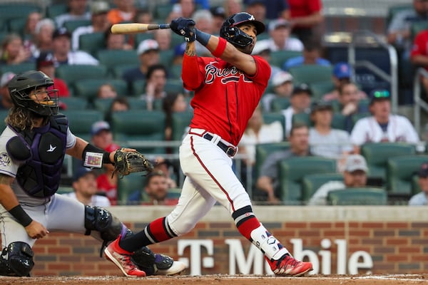 Atlanta Braves’ Eddie Rosario hits a two-run home run during the fourth inning against the Colorado Rockies at Truist Park, Friday, June 16, 2023, in Atlanta. Jason Getz / Jason.Getz@ajc.com)