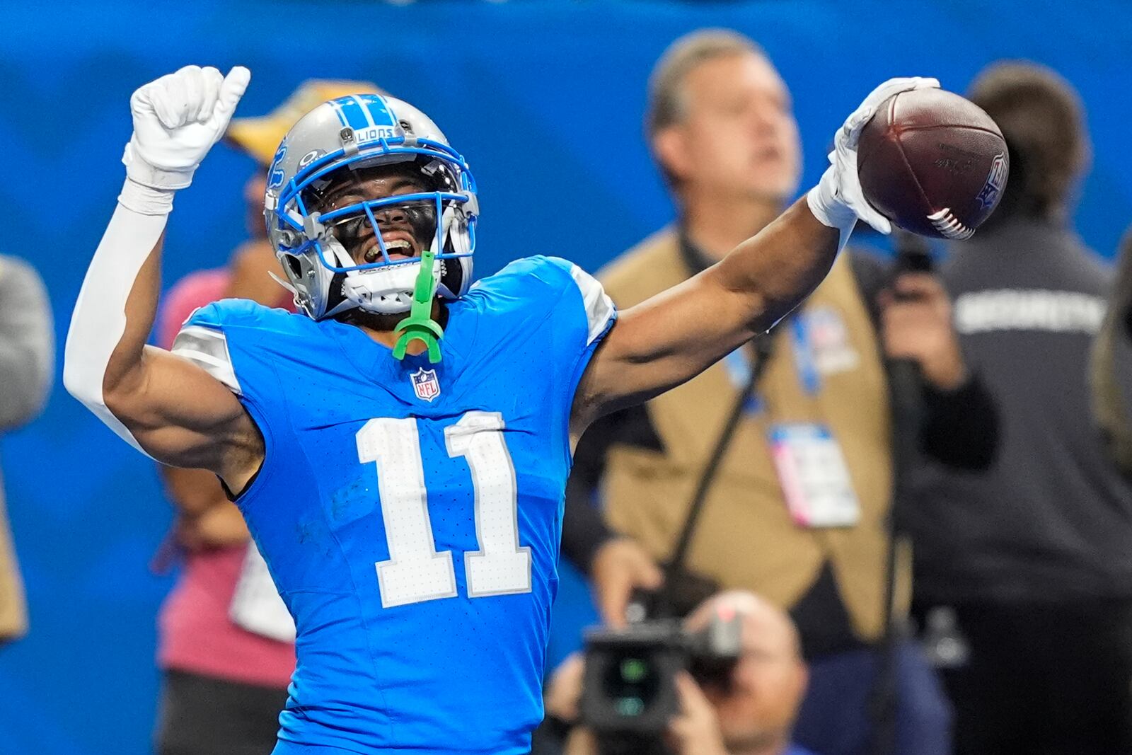 Detroit Lions wide receiver Kalif Raymond (11) celebrates his touchdown during the second half of an NFL football game against the Tennessee Titans, Sunday, Oct. 27, 2024, in Detroit. (AP Photo/Carlos Osorio)