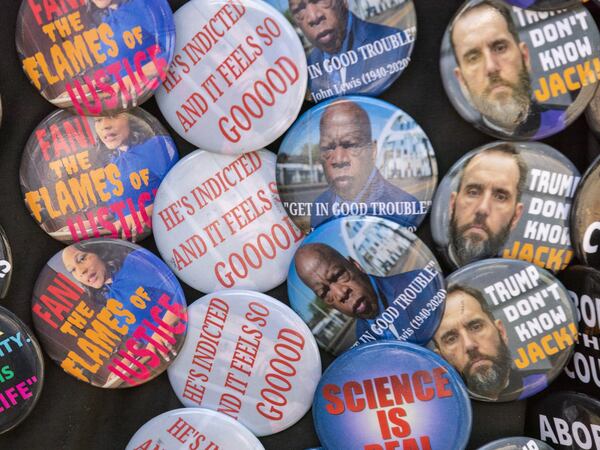 Pins critical of Donald Trump are seen near the Rice Street entrance of the Fulton County Jail in Atlanta on Thursday, August 24, 2023, the day Trump is expected to surrender following his indictment with 18 others. (Arvin Temkar / arvin.temkar@ajc.com)