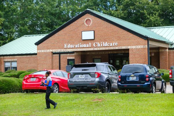 An investigator takes photos at ABC Learning Academy in Stockbridge on Monday.