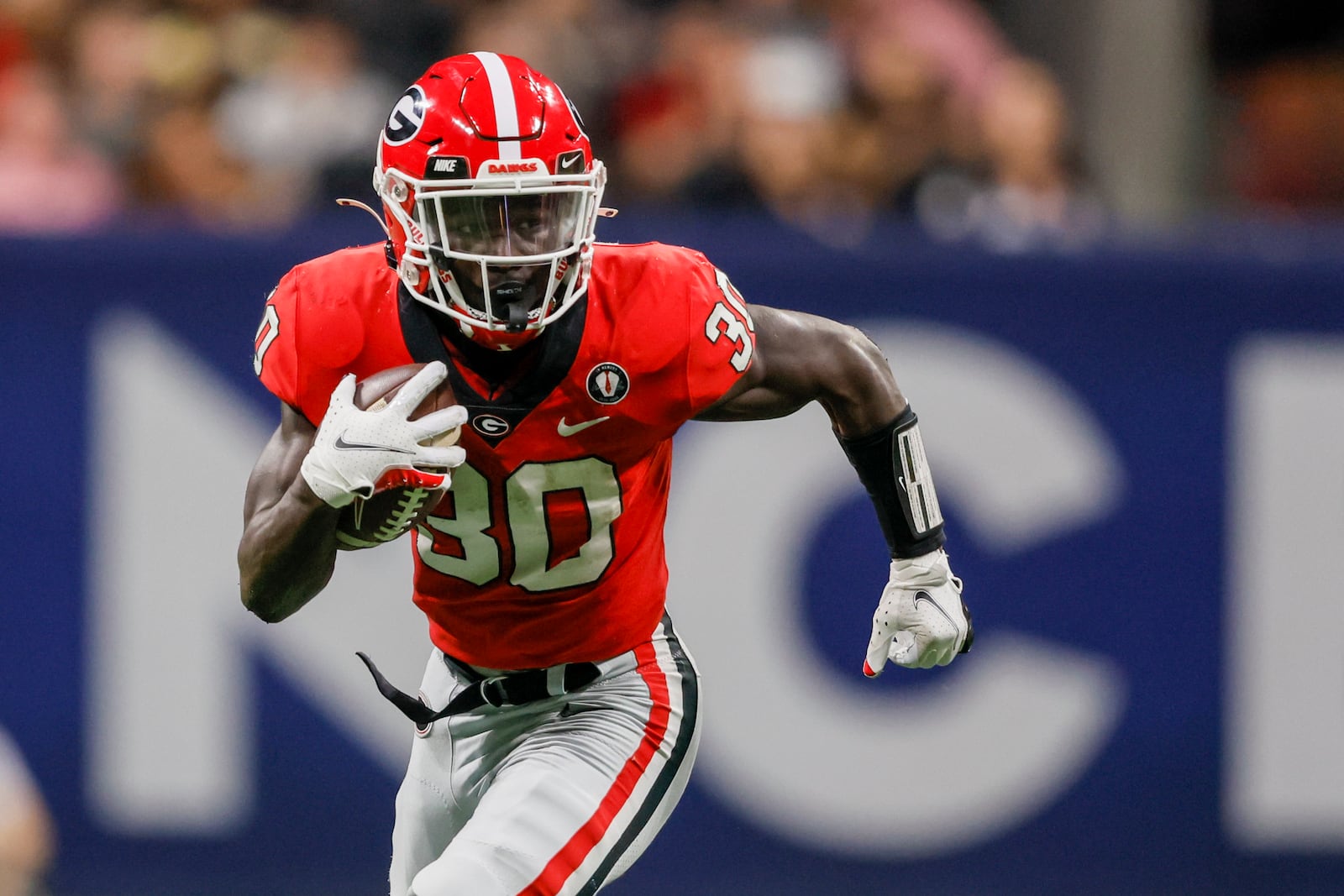 Georgia running back Daijun Edwards (30) runs for yards during their game against the LSU Tigers during the SEC Championship game at Mercedes-Benz Stadium, Saturday, December 3, 2022, in Atlanta. Georgia won 50-30. (Jason Getz / Jason.Getz@ajc.com)