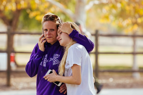 Another unidentified student is reunited with her mother after the shooting.