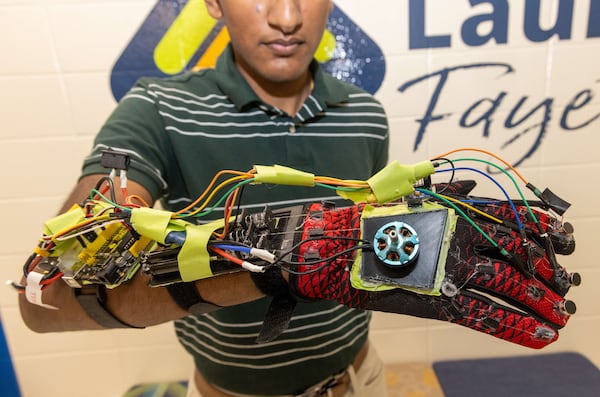 Aadi Vaidya has won recognition for his glove, which is not the first one out there designed to reduce the amount of shaking in a Parkinson's patient. He is learning the skills to be an entrepreneur and inventor from Launch Fayette. PHIL SKINNER FOR THE ATLANTA JOURNAL-CONSTITUTION