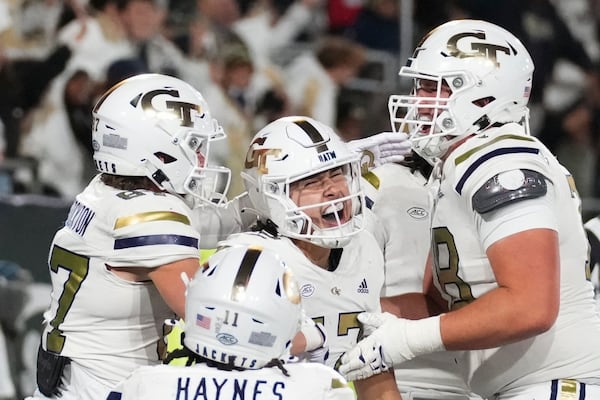 Georgia Tech quarterback Aaron Philo (12) celebrates a touchdown during the second half of an NCAA college football game against North Carolina State, Thursday, Nov. 21, 2024, in Atlanta. (AP Photo/Brynn Anderson)