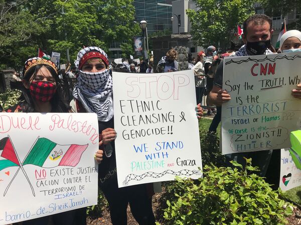 Cileen Alhajbi (center), 21, a nurse's assistant from Lawrenceville, said her Palestinian grandparents are forbidden to return to their family farm. Photo: Bo Emerson/bemerson@ajc.com