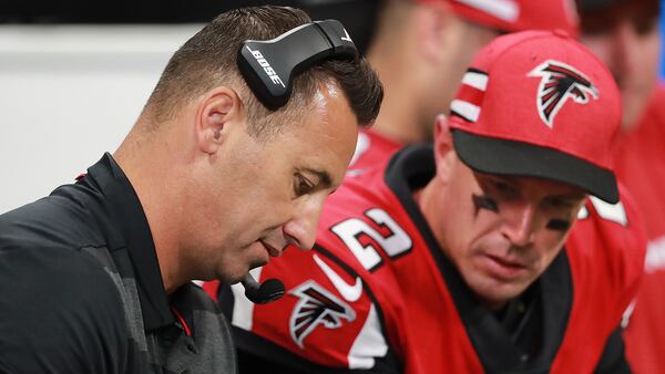 Falcons offensive coordinator Steve Sarkisian and quarterback Matt Ryan confer on the sidelines during the fourth quarter against the New Orleans Saints Sunday, Sept 23, 2018, at Mercedes-Benz Stadium in Atlanta.  (Curtis Compton/ccompton@ajc.com)