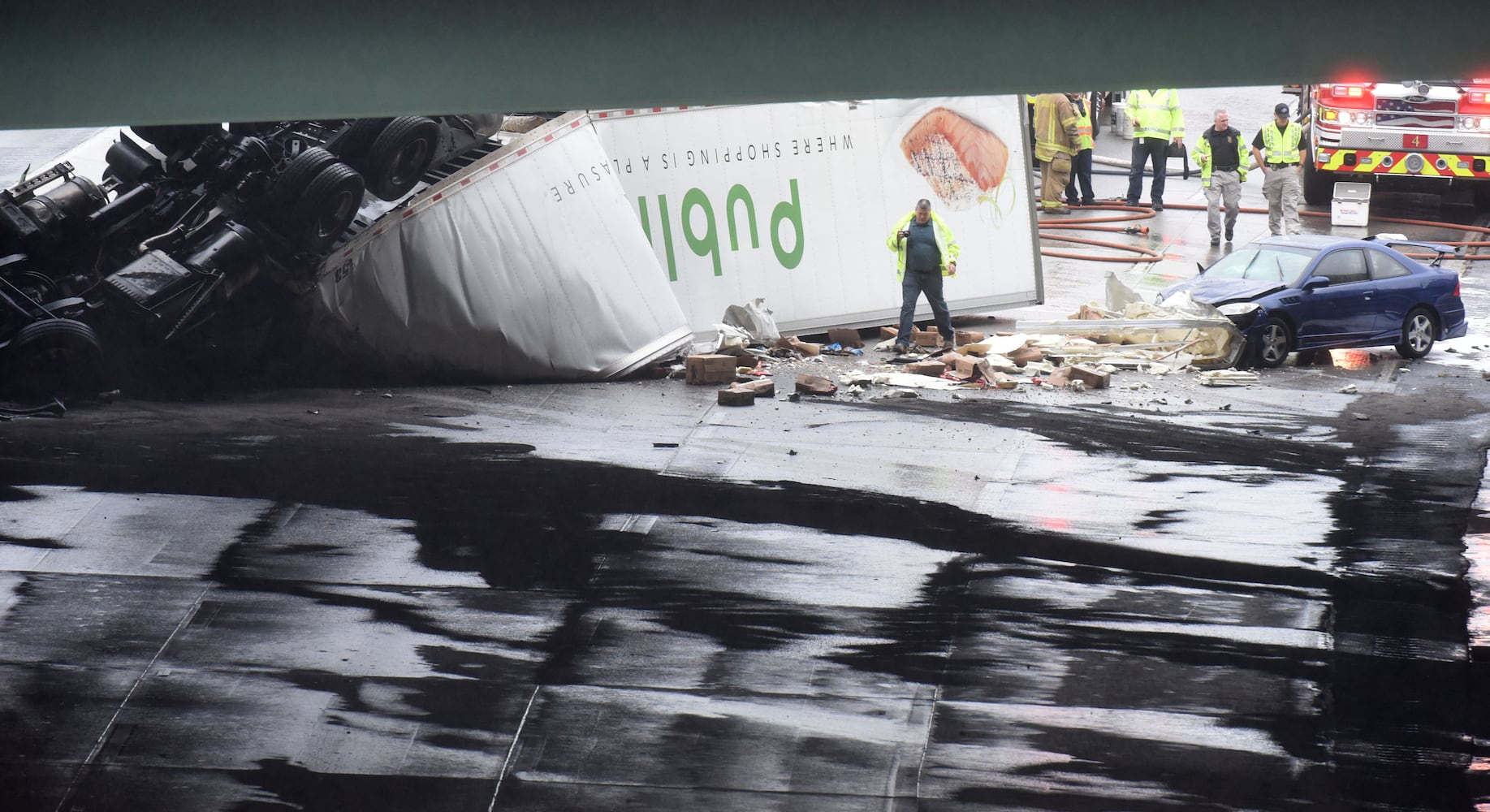 I-285 crash: Trucks plunge off interstate onto Ga. 400