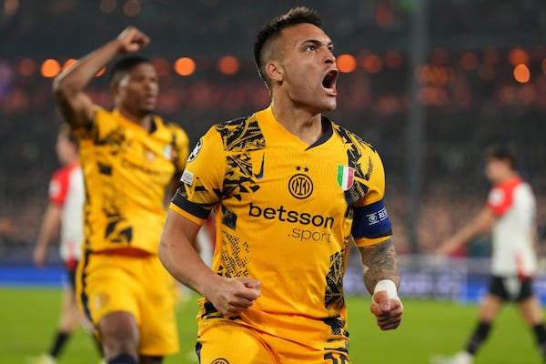 Inter Milan's Lautaro Martinez celebrates after scoring during the Champions League round of 16 first leg soccer match between Feyenoord and Inter Milan in Rotterdam, Netherlands, Wednesday, March 5, 2025. (AP Photo/Peter Dejong)