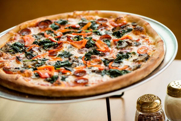 Junior's 16-inch pizza with pepperoni,  red bell peppers, mushrooms, and spinach. Photo credit- Mia Yakel.