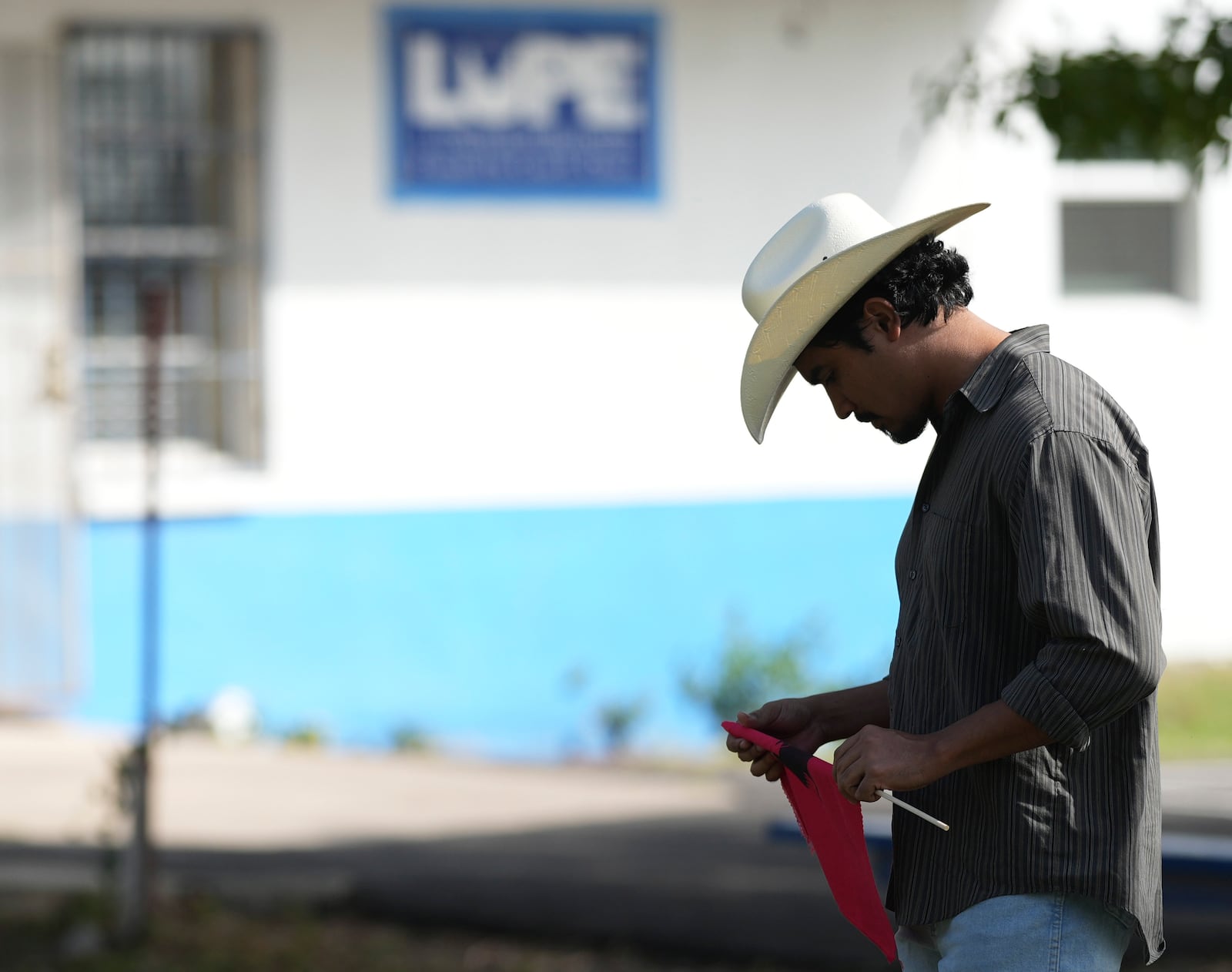 Michael Mireles, Votes Director of Civic Engagement for La Unión del Pueblo Entero (LUPE), listens as the group holds a news conference to talk about yesterday's election in San Juan, Texas, Wednesday, Nov. 6, 2024. (AP Photo/Eric Gay)