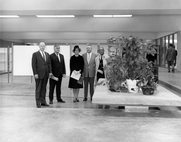 Interior lobby of Harper High School with members involved in the school opening, Dec. 22, 1962. People partially identified as, left to right: Dr. John Litson, Joe Annsamo, Sara Mitchell, Dr. Ed. S. Cook, Jr., Dr. R. Clements. (Ken Patterson / AJC Archive at GSU Library AJCP296-056b)