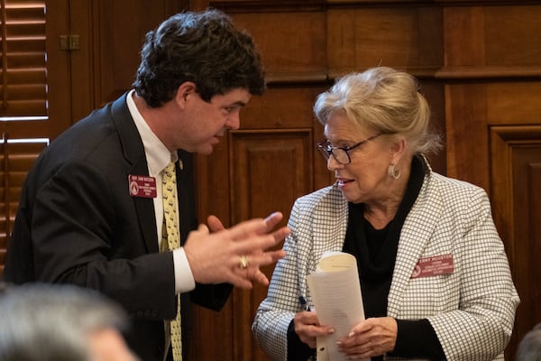 Former Rep. Sam Watson (R-Moultrie), seen talking with Rep. Penny Houston (R-Nashville) in this file photo, has picked up support from Gov. Brian Kemp for his bid for an open state Senate senate.  (Ben Gray for the AJC)