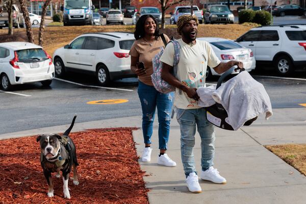 New parents Alandria Worthy and Deandre Phillips, whose baby Nandi was born in a McDonald’s bathroom a day before Thanksgiving, arrive for the shower.