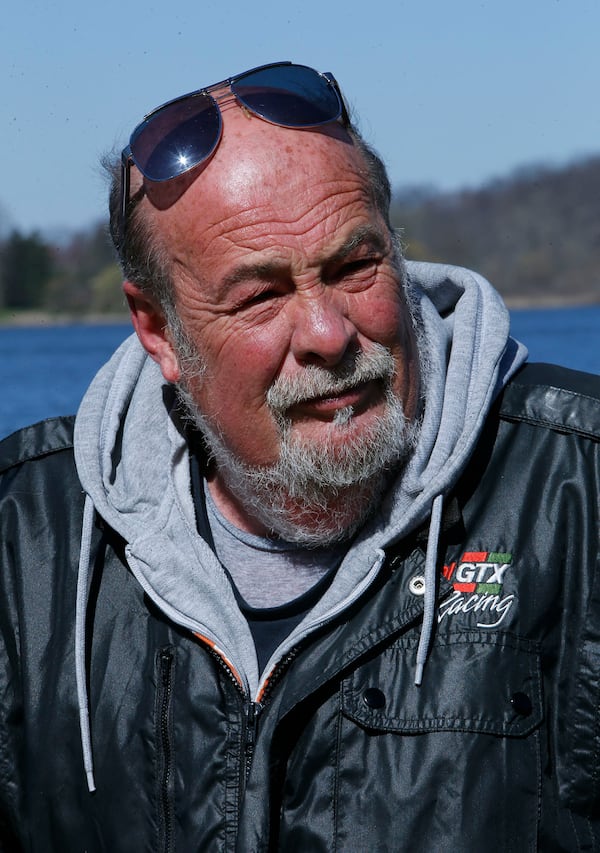 Don Thorn talks about painting rocks before placing some around Springfield Lake on April 20, 2018, in Springfield Township, Ohio. (Karen Schiely/Akron Beacon Journal/TNS)