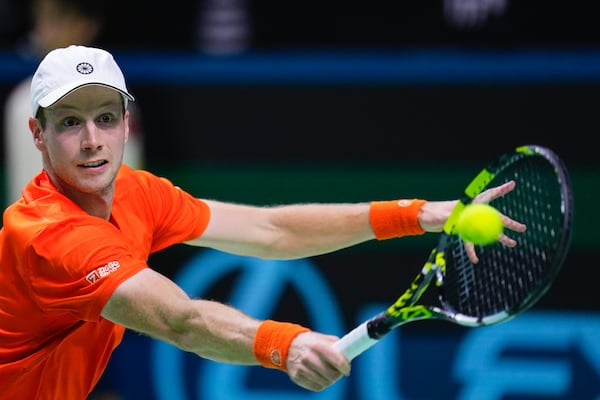 Netherlands' tennis player Botic Van De Zandschulp competes against Spain's Rafael Nadal during a Davis Cup quarterfinal match at Martin Carpena Sports Hall in Malaga, southern Spain, on Tuesday, Nov. 19, 2024. (AP Photo/Manu Fernandez)