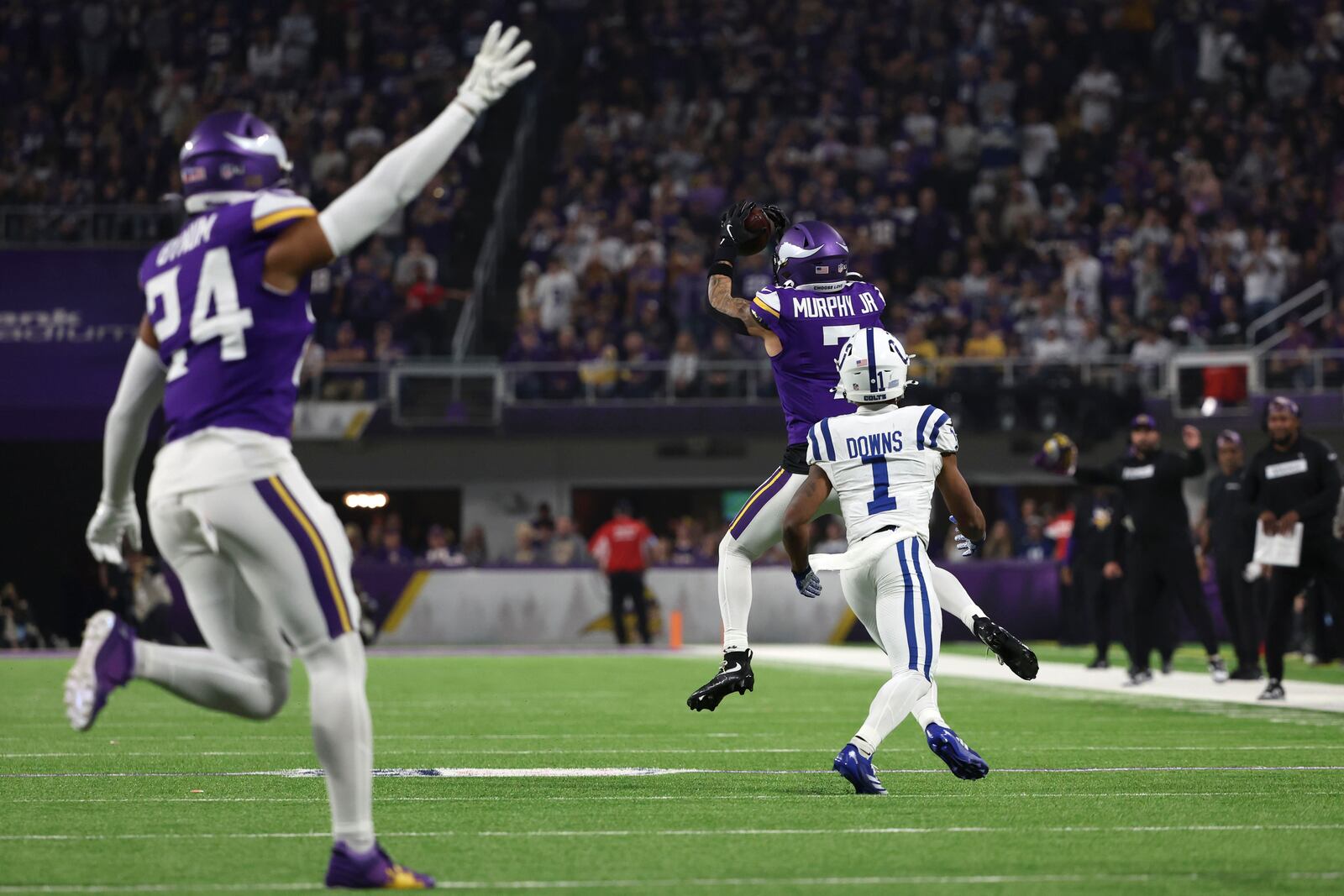 Minnesota Vikings cornerback Byron Murphy Jr. (7) intercepts a pass intended for Indianapolis Colts wide receiver Josh Downs (1) during the second half of an NFL football game, Sunday, Nov. 3, 2024, in Minneapolis. (AP Photo/Ellen Schmidt)