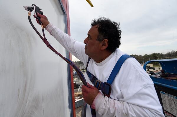 The Big Chicken was being repainted Wednesday, March 22, 2017. Marietta's roadside icon at 12 Cobb Parkway is being renovated.