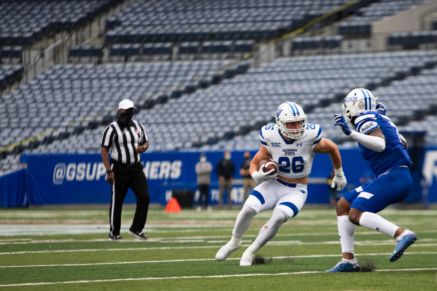 Tucker Gregg (26), rushes the ball during the Georgia State University spring football game on Friday. CHRISTINA MATACOTTA FOR THE ATLANTA JOURNAL-CONSTITUTION