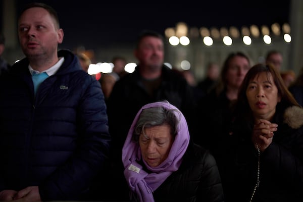 Catholic worshippers pray the Rosary for Pope Francis in St. Peter's Square at The Vatican, Thursday, March 6, 2025. (AP Photo/Francisco Seco)