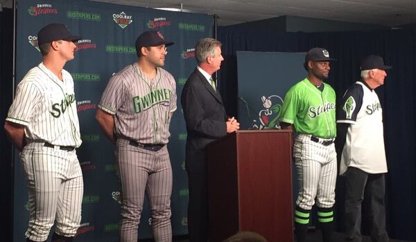 Gwinnett GM North Johnson speaks as Lucas Sims, Matt Tuiasosopo, Xavier Avery and hall of famer Phil Niekro model the new Stripers uniforms. (Gabriel Burns / AJC)