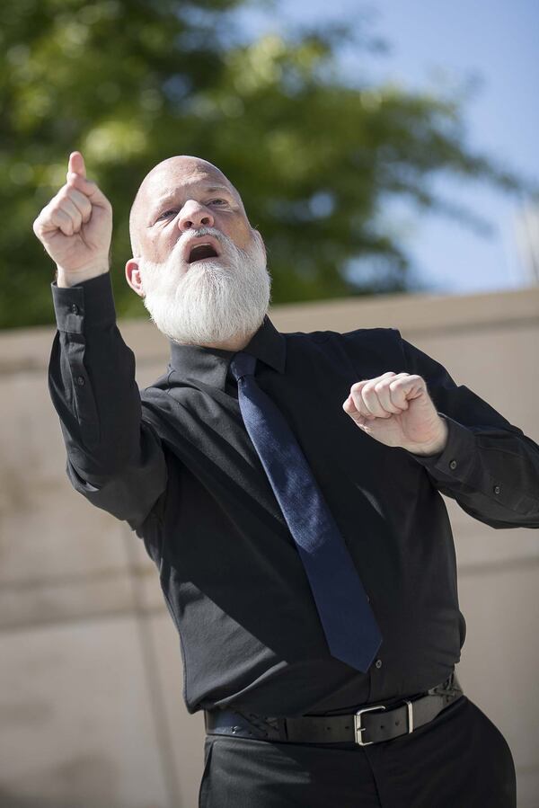 David Cowan, an American Sign language deaf interpreter with All Hands On, a nonprofit that fosters relationships between the deaf and emergency managers, interprets remarks made by Gov. Brian Kemp during a press conference April 20, 2020. Kemp says Cowan “brings a level of dedication to his work that no one can match.” 