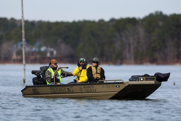 Laurence Walker, a volunteer with the Cajun Navy Relief, left, takes two volunteers out on his boat on Lake Oconee to search for Gary Jones, Tuesday, February, 18, 2025, in Eatonton, Ga. The Putnam County sheriff is investigating and searching after Spelman College instructor Joycelyn Nicole Wilson and an Atlanta private school coach Gary Jones went missing on Lake Oconee over a week ago, Saturday Feb. 8th. The body of Wilson was found Sunday, Feb. 9th and Jones has not been found. (Jason Getz / AJC)