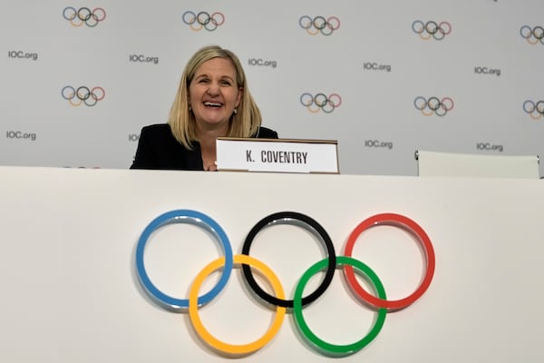 Kirsty Coventry laughs during a press conference after she was elected as the new IOC President at the International Olympic Committee 144th session in Costa Navarino, western Greece, Thursday, March 20, 2025. (AP Photo/Thanassis Stavrakis)