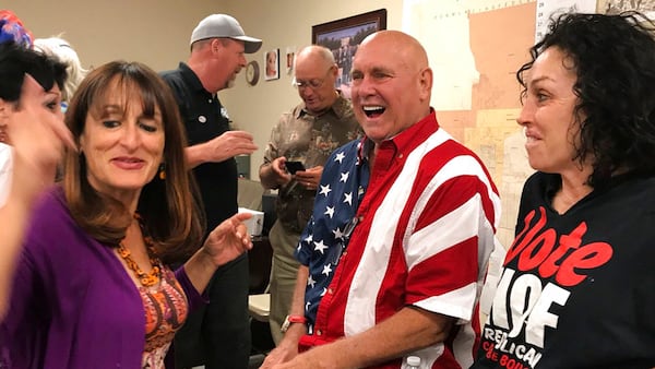 FILE - In this June 12, 2018, file photo, Nevada brothel owner Dennis Hof, second from right, celebrates with Heidi Fleiss, right, and others after winning the primary election in Pahrump, Nevada. Hof won the general election Tuesday. (David Montero/Los Angeles Times via AP)