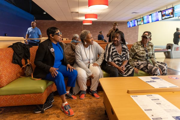 (L) Lorraine Cochran-Johnson, a candidate for DeKalb CEO, reacts during a senior bowling event at Stars and Strikes in Stone Mountain on Thursday, March 7, 2024, which she sponsored as part of her campaign. (Arvin Temkar / arvin.temkar@ajc.com)