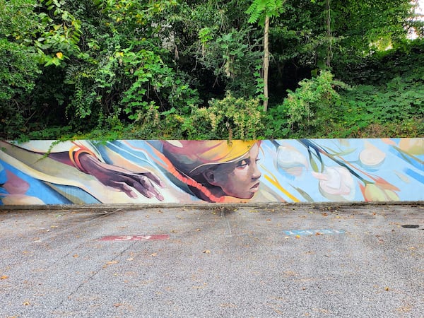 “Evanesce," by illustrator, fine artist and muralist Trudy Tran, surprises customers parking behind the Sam Flax art supply store on Northside Drive. Courtesy of Arthur Rudick