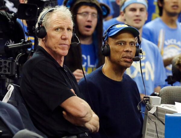 Former UCLA and Los Angeles Lakers greats Bill Walton, left, and Kareem Abdul-Jabbar sit at the broadcasting table during an NCAA college basketball game between UCLA and Oregon State in Los Angeles, Thursday, Jan. 17, 2013. UCLA won 74-64. (AP Photo/Reed Saxon)