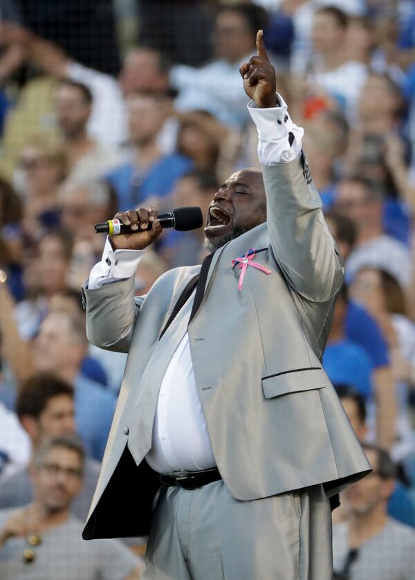 The national anthem is performed by Keith Williams Jr. before Game 1 of baseball's World Series between the Los Angeles Dodgers and the Houston Astros Tuesday, Oct. 24, 2017, in Los Angeles. (AP Photo/Matt Slocum)