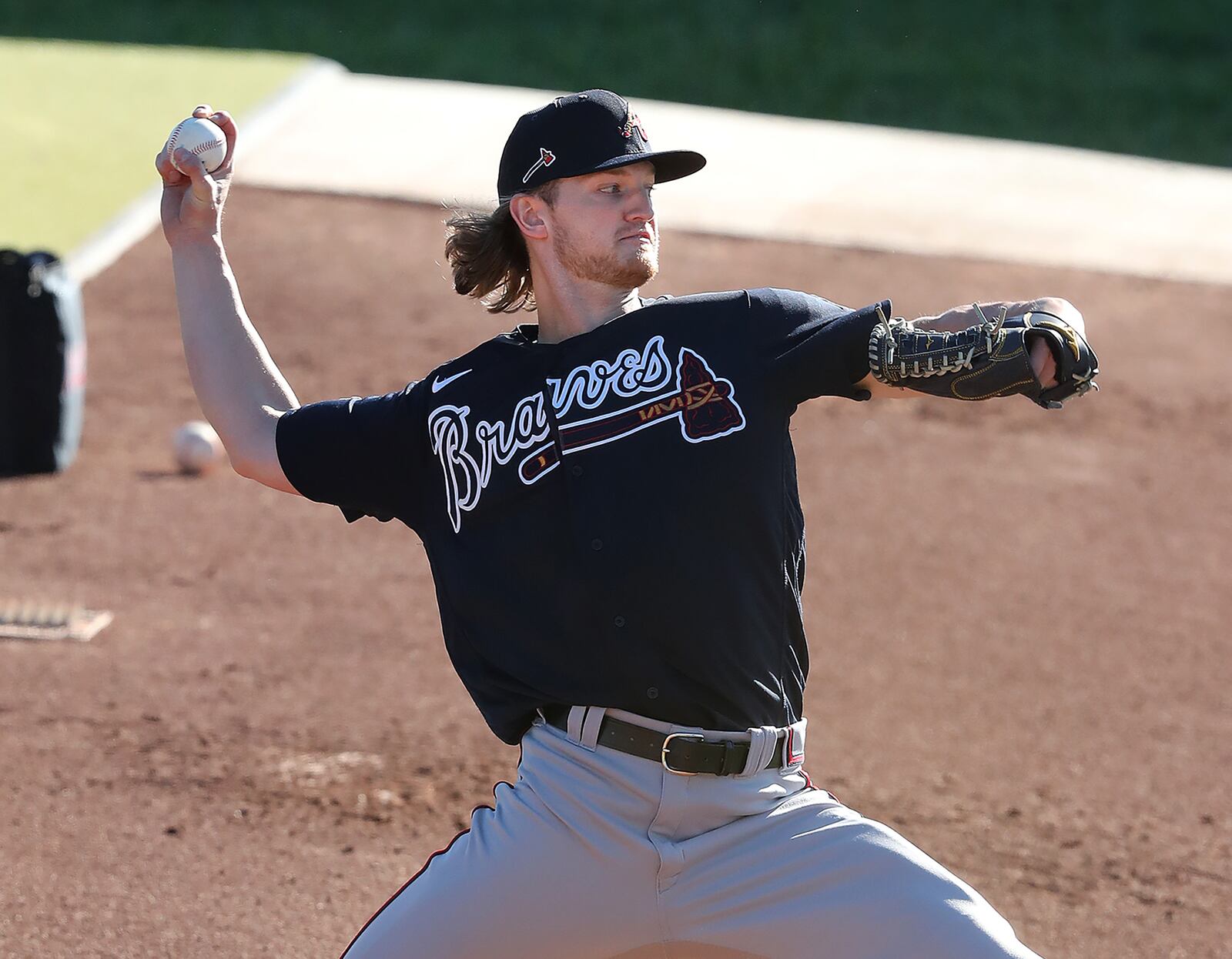 Rehabbing from a torn right Achilles tendon, Atlanta Braves righthander Mike Soroka throws from the practice mounds getting in a morning workout at spring training Thursday, Feb. 25, 2021, at CoolToday Park in North Port, Fla. (Curtis Compton / Curtis.Compton@ajc.com)