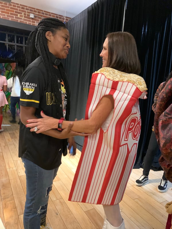 Missy Byrd and Theresa "T-Dog" Cooper during the "Survivor" watch party Oct. 27, 2021. RODNEY HO/rho@ajc.com